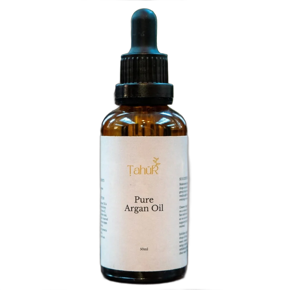 Pure argan oil in a glass dropper bottle